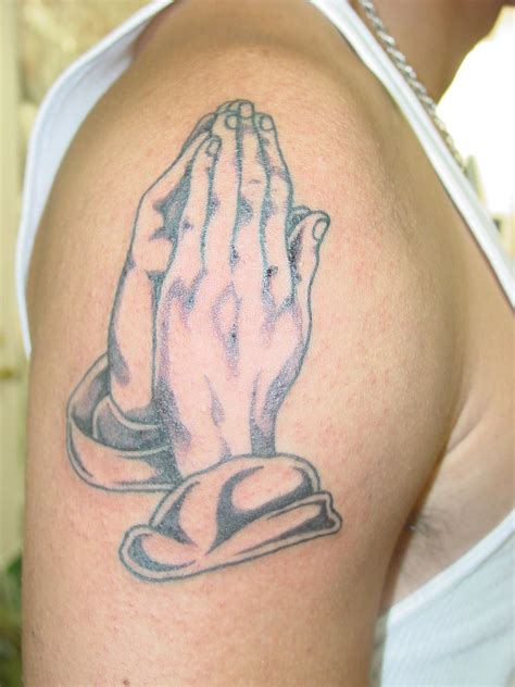 Praying hands tattoo meaning - The Praying Hands Tattoo Meanings. The palms together is a design has deep religious meanings, praying for guidance, praying for help, or praying that others rest in peace. The praying hand tattoos can be symbolic of a person wanting quiet time within the human body so they can work on a more spiritual level. Once the mind and the hands become ...
